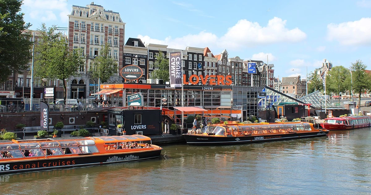 View of Amsterdam's historic canal district from a canal cruise. Book ticket on Tours and Tickets!